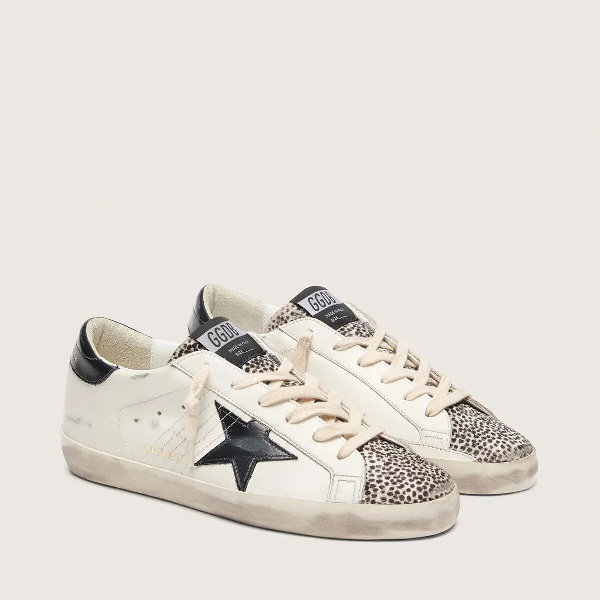 Golden Goose Super-Star Ltd In White Leather With Black Star And Pony Skin Details Golden Goose Super-Star Ltd In White Leather With Black Star And Pony Skin Details